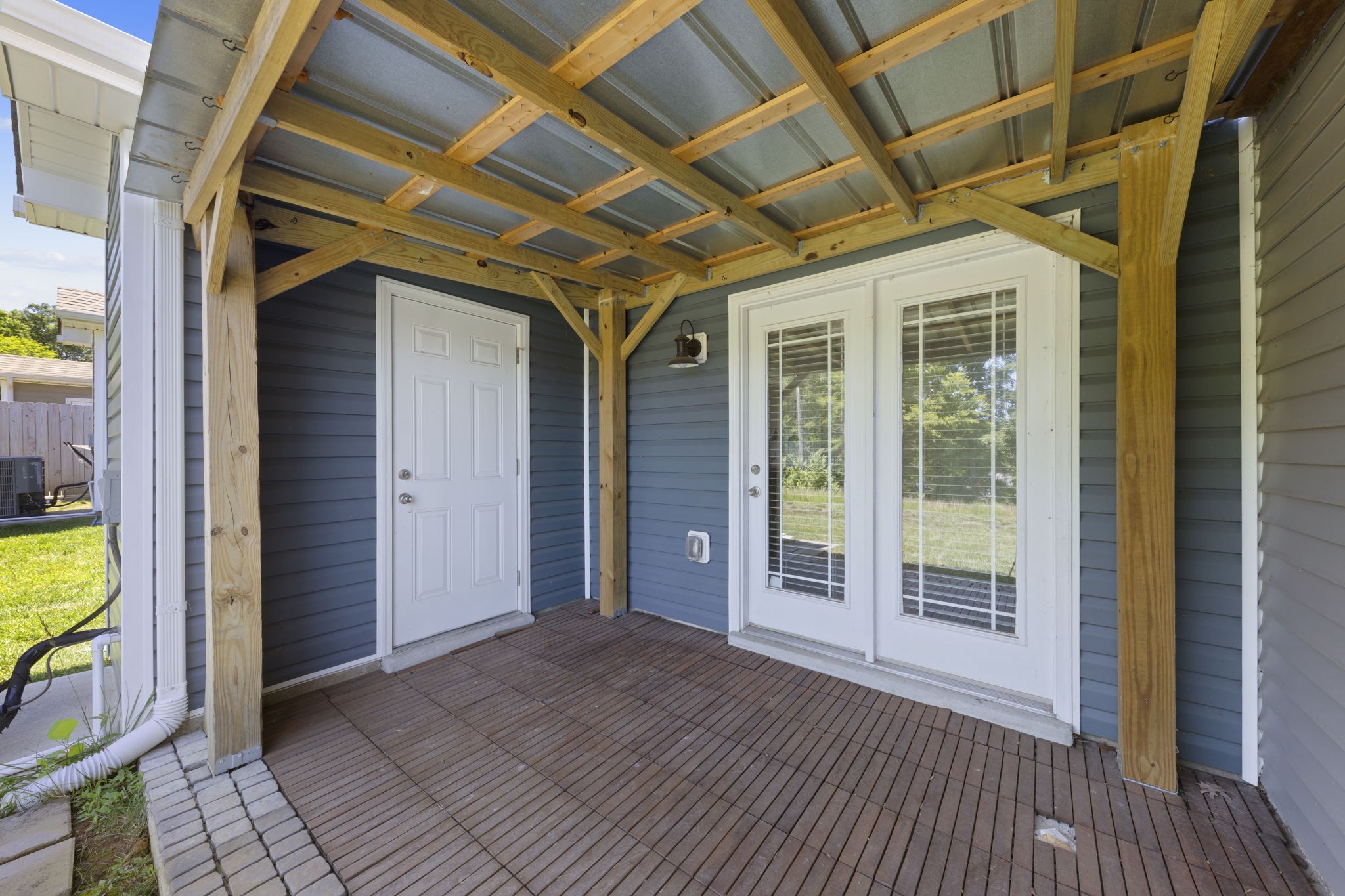 119 Davis Ridge Lane Clarksville, TN 37040 - Photo 27 of 30 a view of a hallway with wooden floor and a glass door