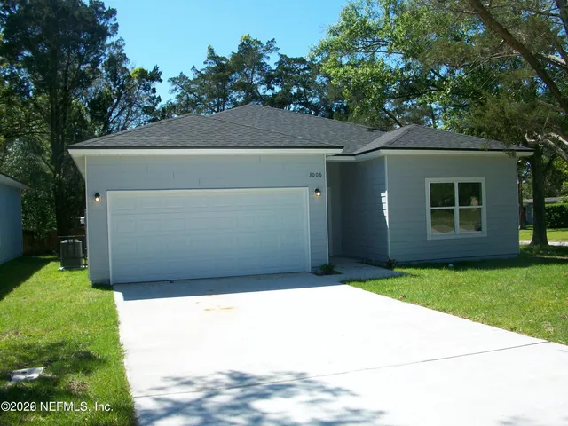 a backyard of a house with lots of green space
