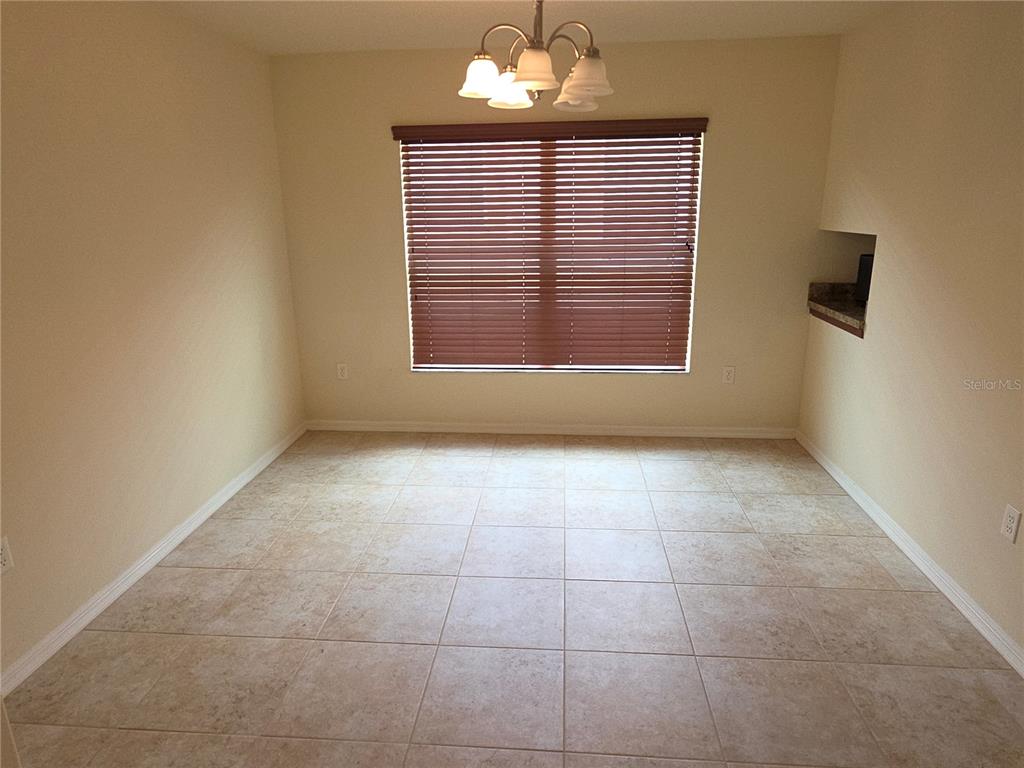 4284 High Ridge Avenue Spring Hill, FL 34609 - Photo 7 of 40 a view of an empty room with a window