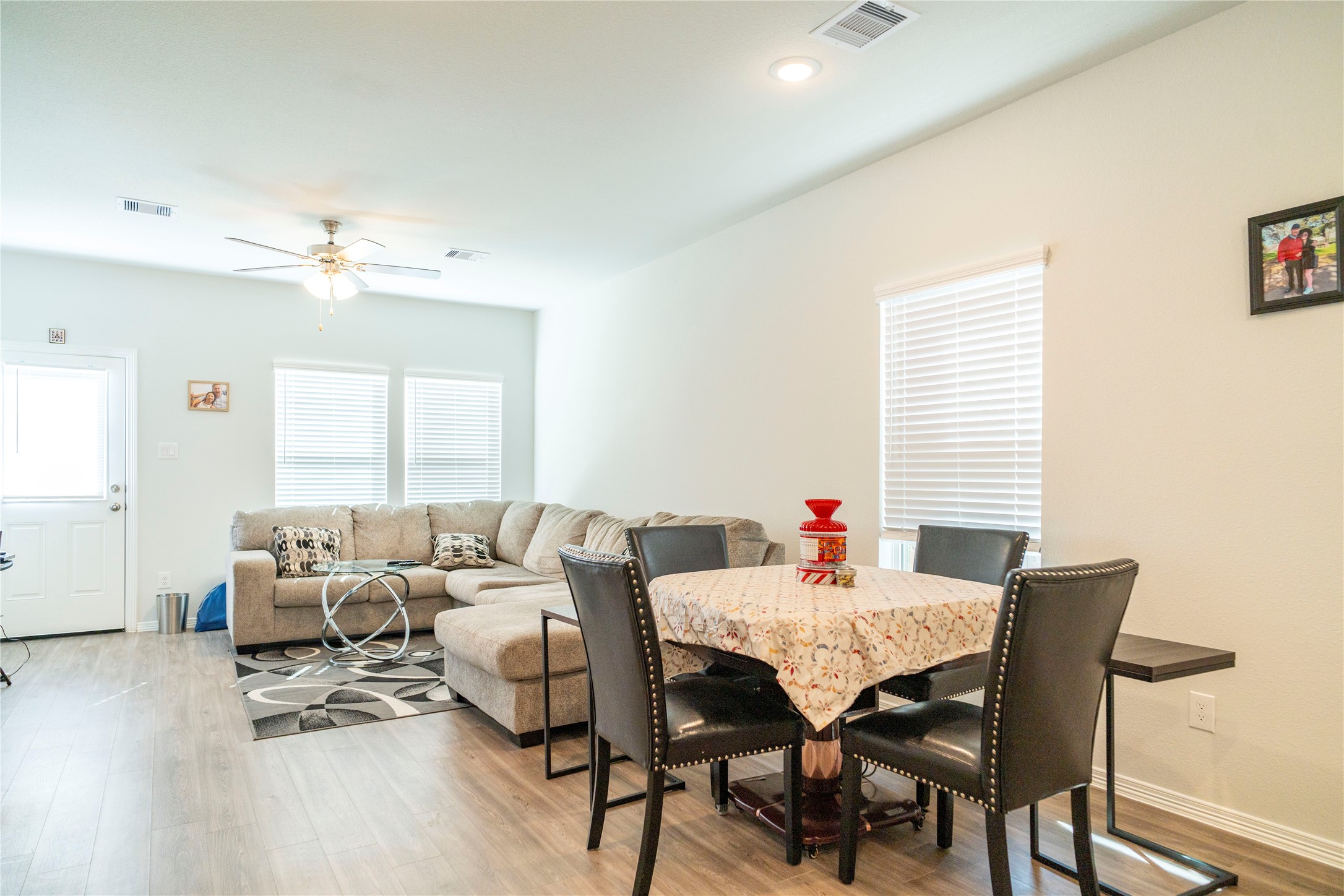 23319 Spring Genesis Lane Katy, TX 77493 - Photo 11 of 22 a living room with furniture and a wooden floor