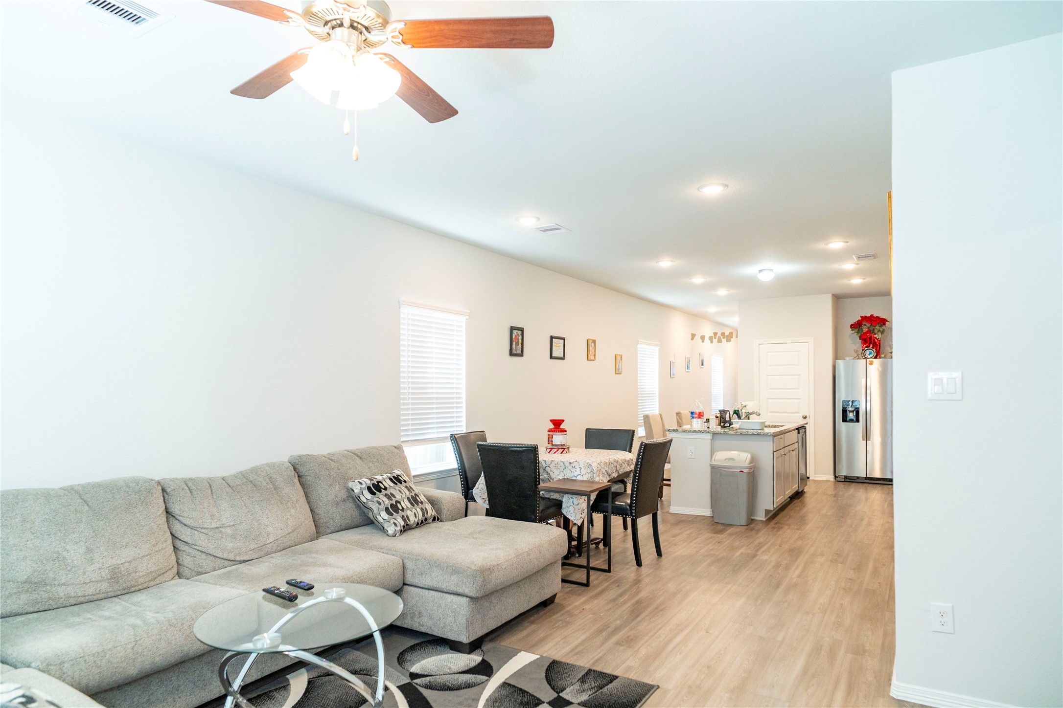 23319 Spring Genesis Lane Katy, TX 77493 - Photo 14 of 22 a living room with furniture and a wooden floor