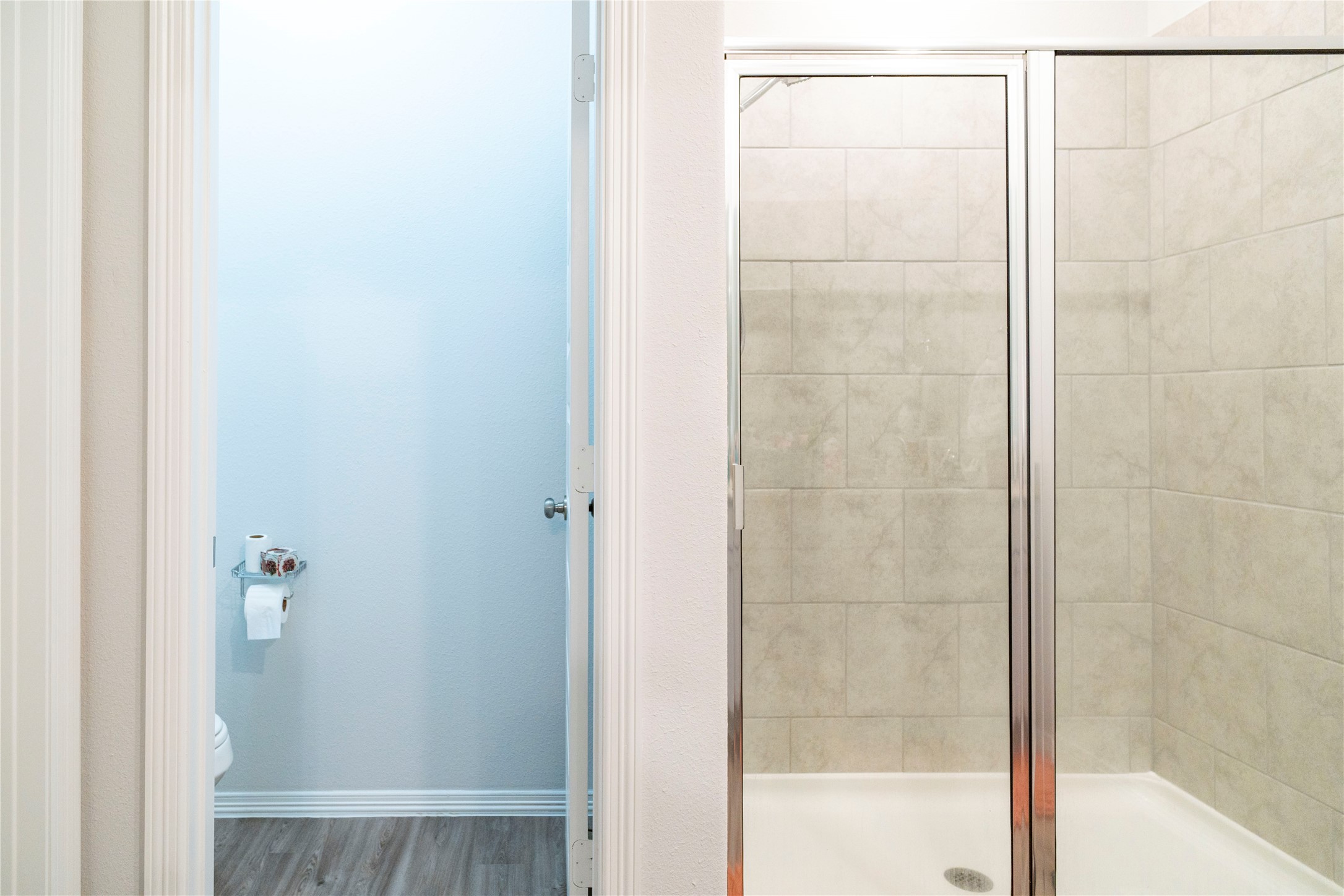 23319 Spring Genesis Lane Katy, TX 77493 - Photo 16 of 22 a bathroom with a glass shower door