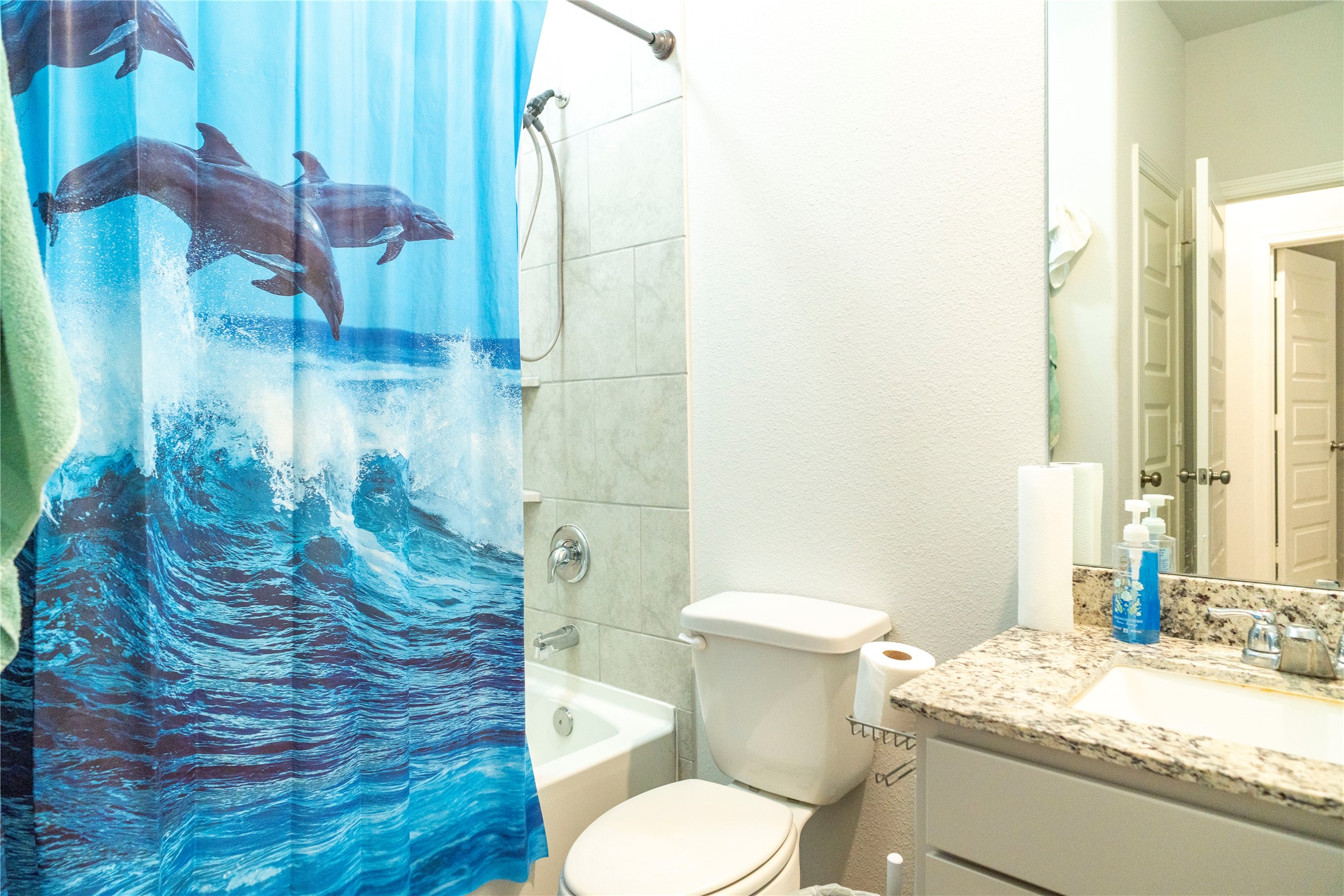 23319 Spring Genesis Lane Katy, TX 77493 - Photo 17 of 22 a bathroom with a granite countertop sink and a mirror