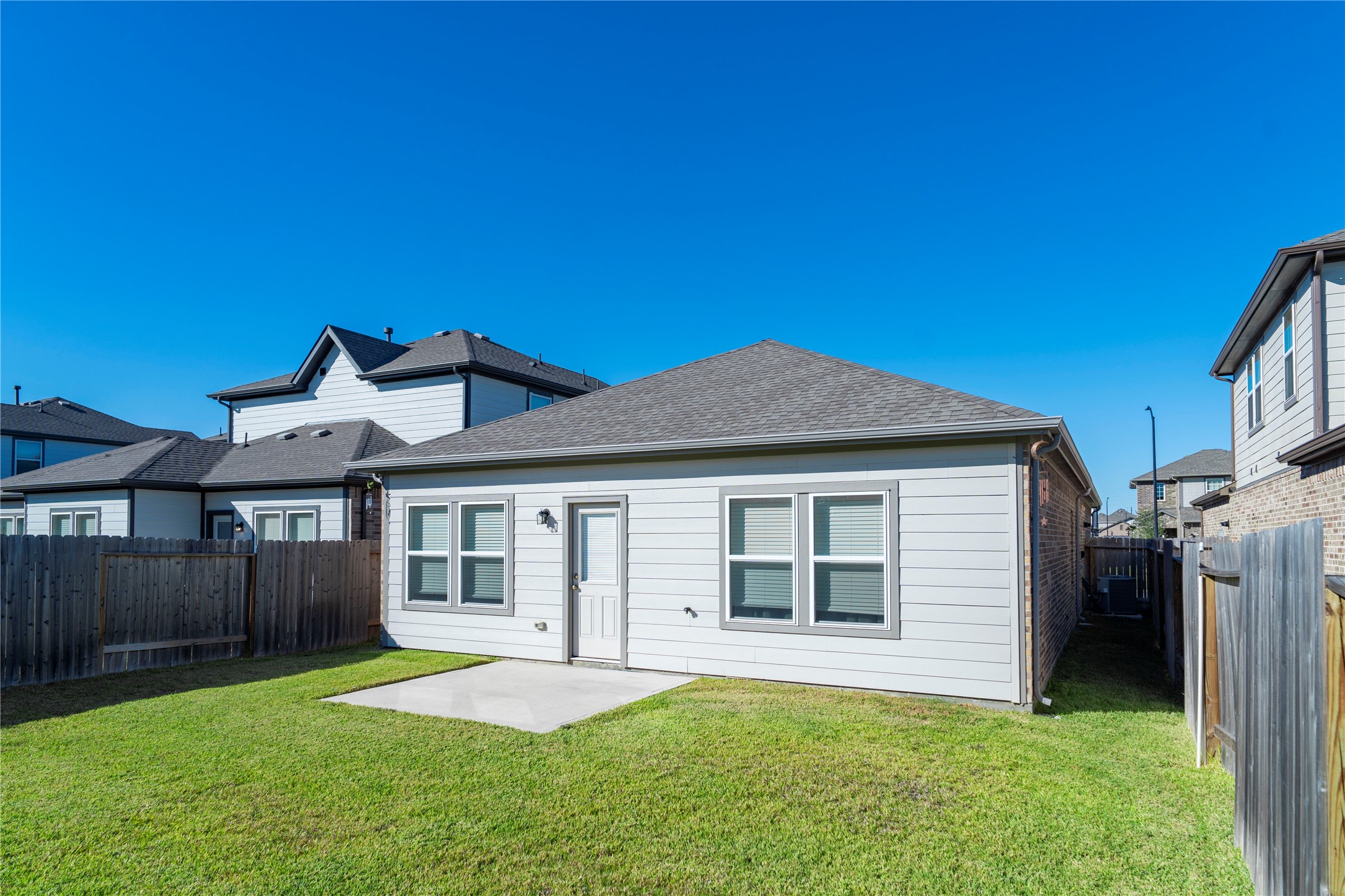 23319 Spring Genesis Lane Katy, TX 77493 - Photo 19 of 22 a front view of a house with a yard