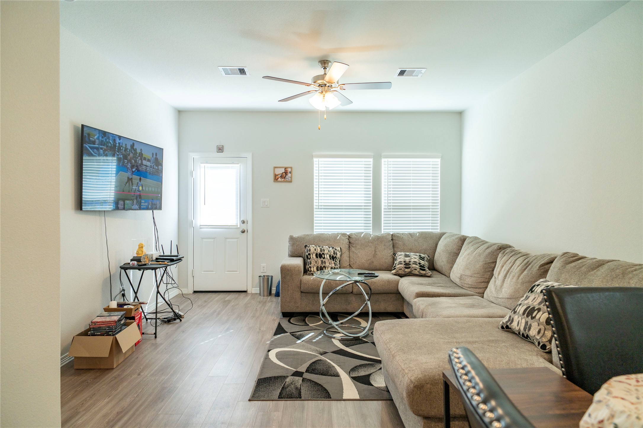 23319 Spring Genesis Lane Katy, TX 77493 - Photo 2 of 22 a living room with furniture and wooden floor