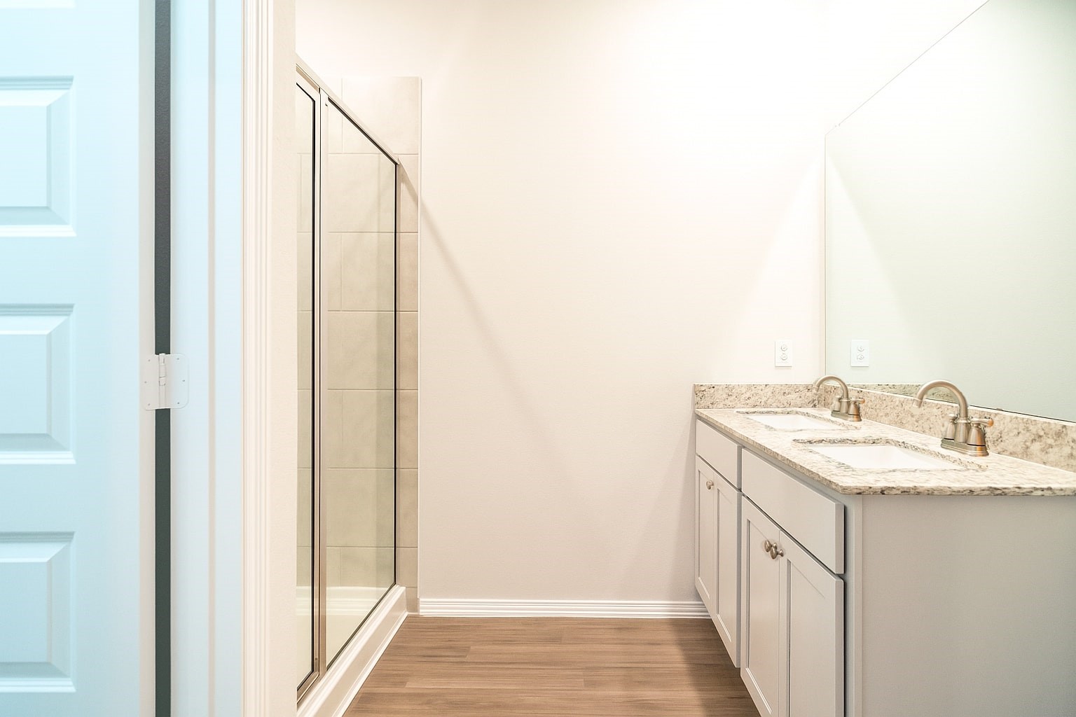 23319 Spring Genesis Lane Katy, TX 77493 - Photo 7 of 22 a bathroom with a sink and a mirror