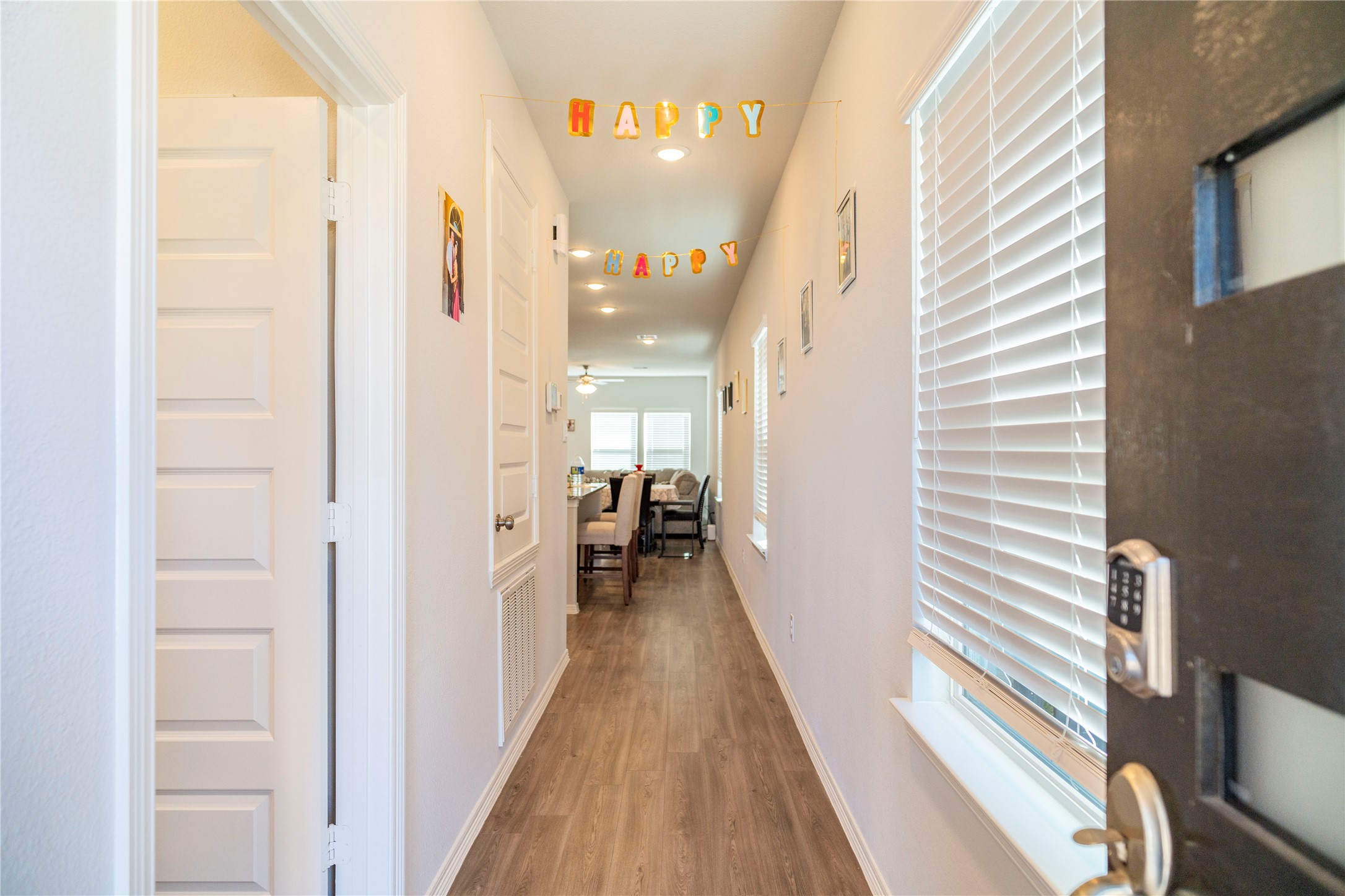 23319 Spring Genesis Lane Katy, TX 77493 - Photo 9 of 22 a view of a hallway with a dining table chairs