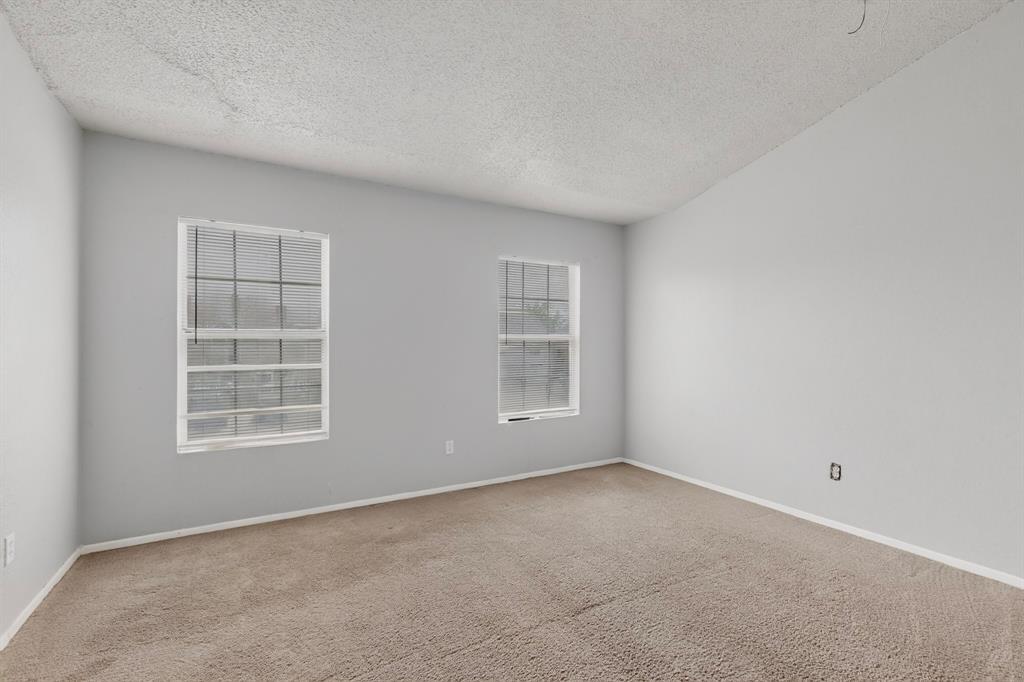 9467 Olde Towne Row Dallas, TX 75227 - Photo 13 of 26 an empty room with windows