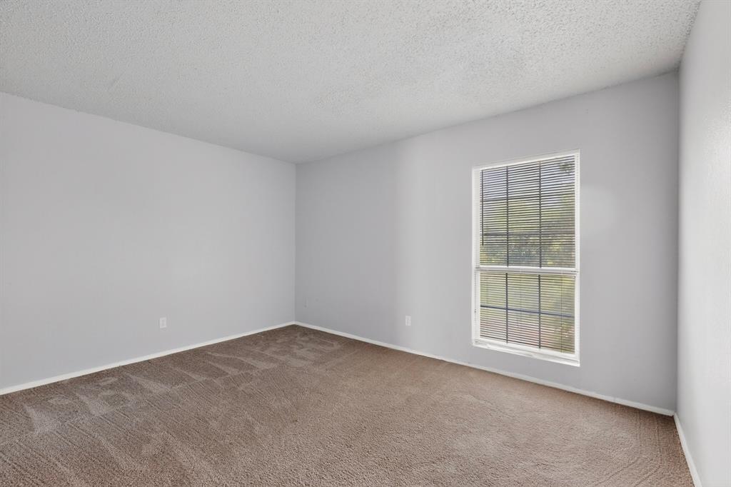 9467 Olde Towne Row Dallas, TX 75227 - Photo 24 of 26 an empty room with a window