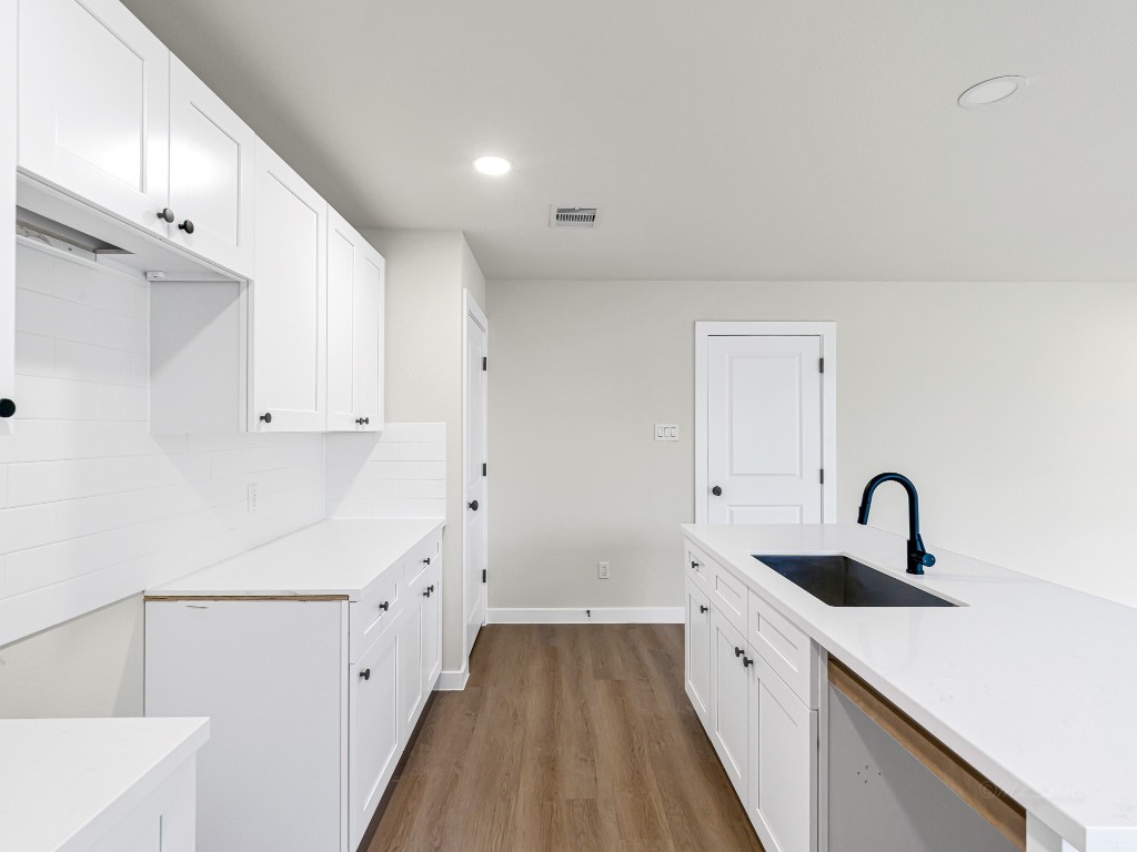 1006 4th Street Hempstead, TX 77445 - Photo 12 of 29 a spacious bathroom with a double vanity sink and mirror
