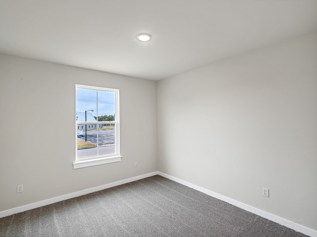 1006 4th Street Hempstead, TX 77445 - Photo 18 of 29 an empty room with windows