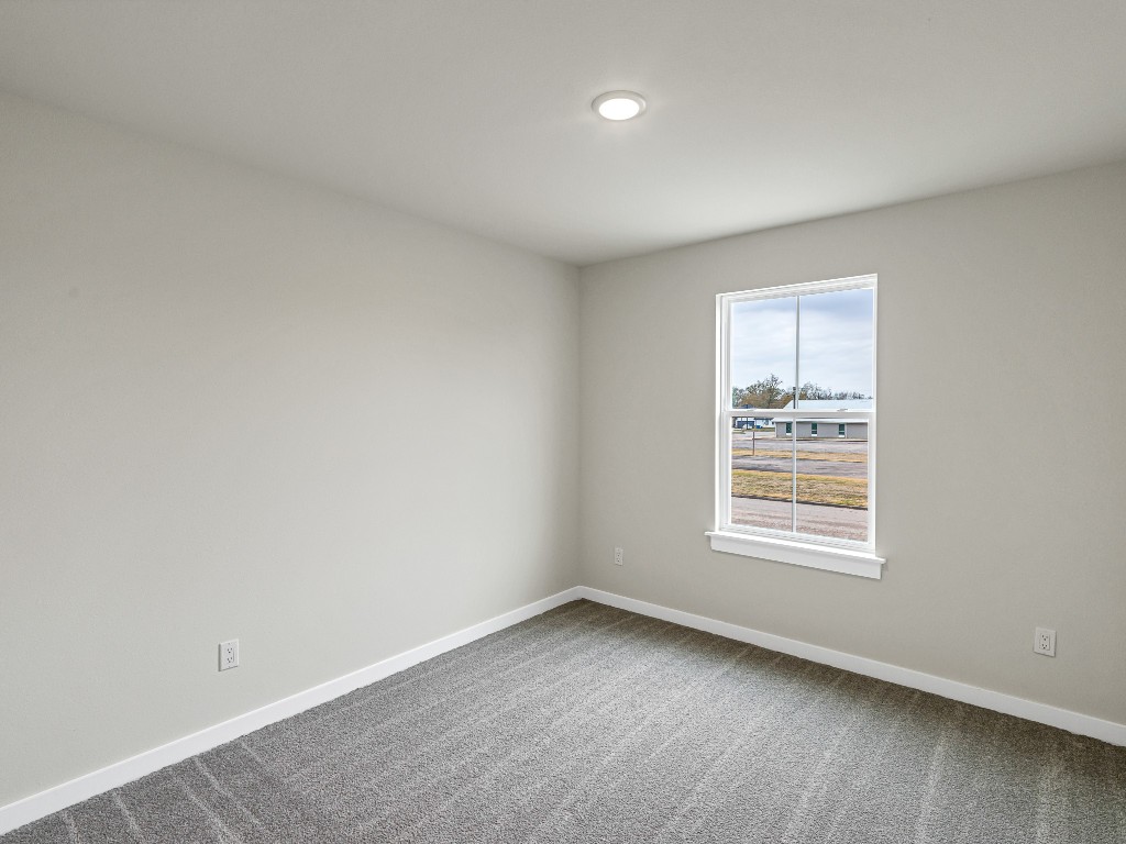 1006 4th Street Hempstead, TX 77445 - Photo 19 of 29 an empty room with a window
