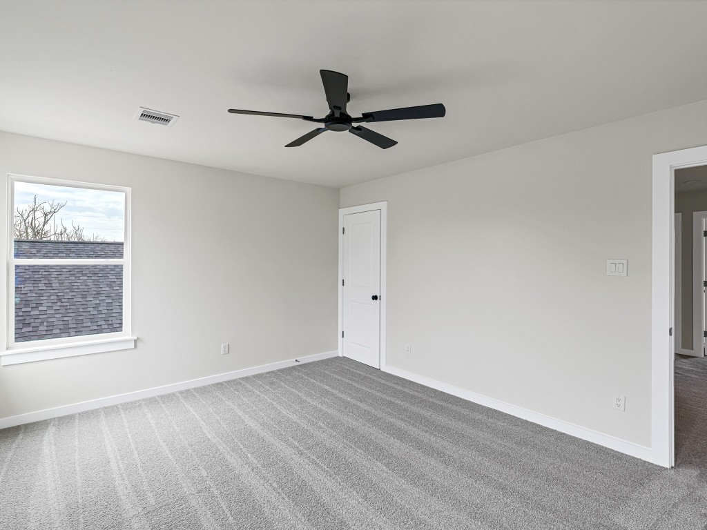 1006 4th Street Hempstead, TX 77445 - Photo 22 of 29 wooden floor in an empty room with a window
