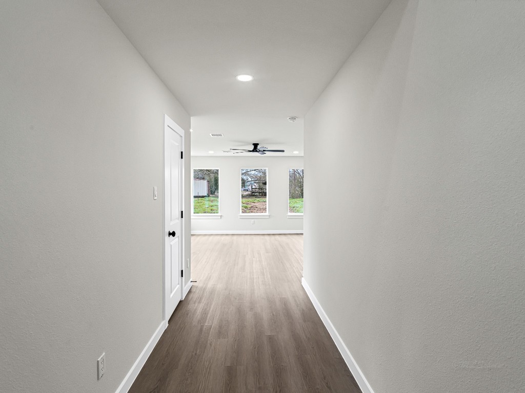 1006 4th Street Hempstead, TX 77445 - Photo 5 of 29 a view of a hallway with wooden floor and windows