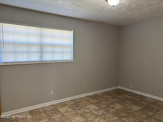 a view of empty room with a window