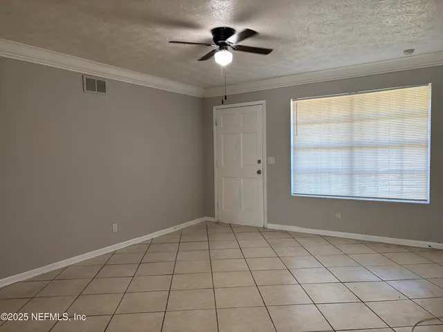 a view of an empty room and window