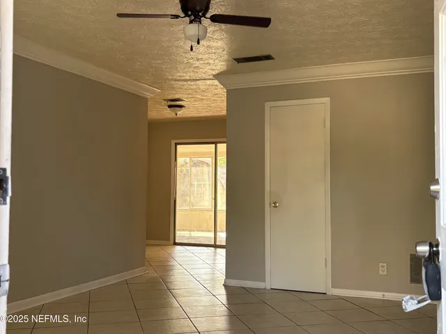 a view of a hallway with a chandelier