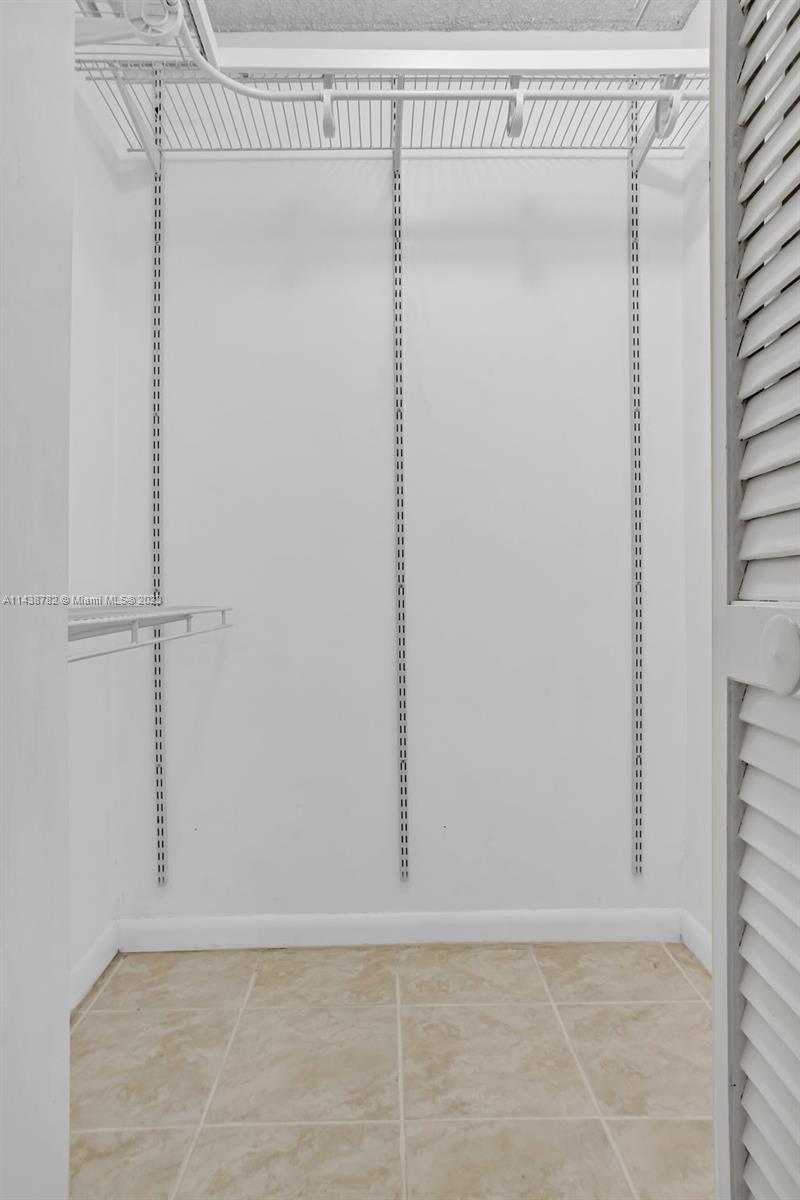 9140 Southwest 123rd Court, Unit 210Q Miami, FL 33186 - Photo 15 of 26 a view of an empty room