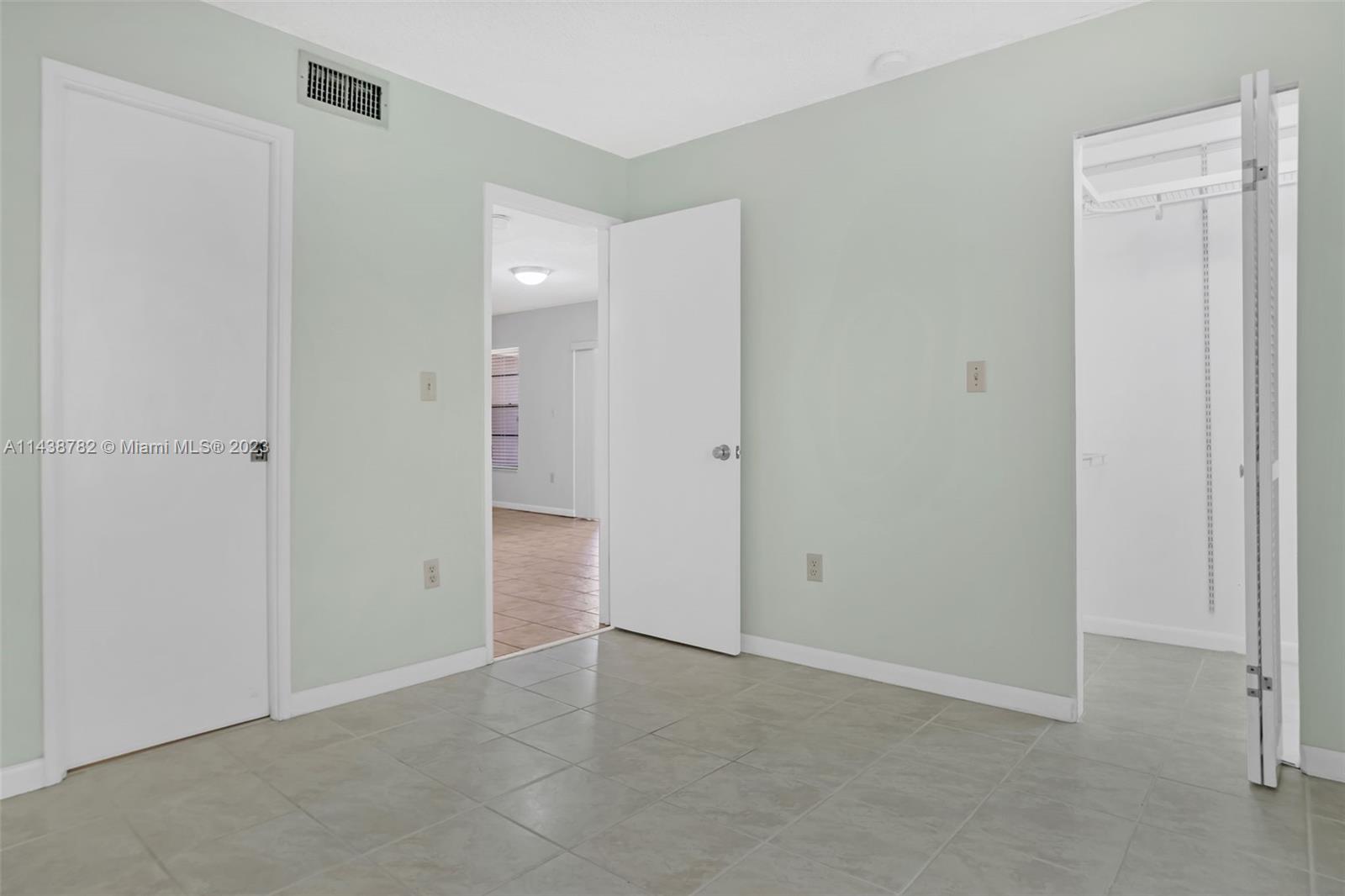 9140 Southwest 123rd Court, Unit 210Q Miami, FL 33186 - Photo 19 of 26 a view of an empty room
