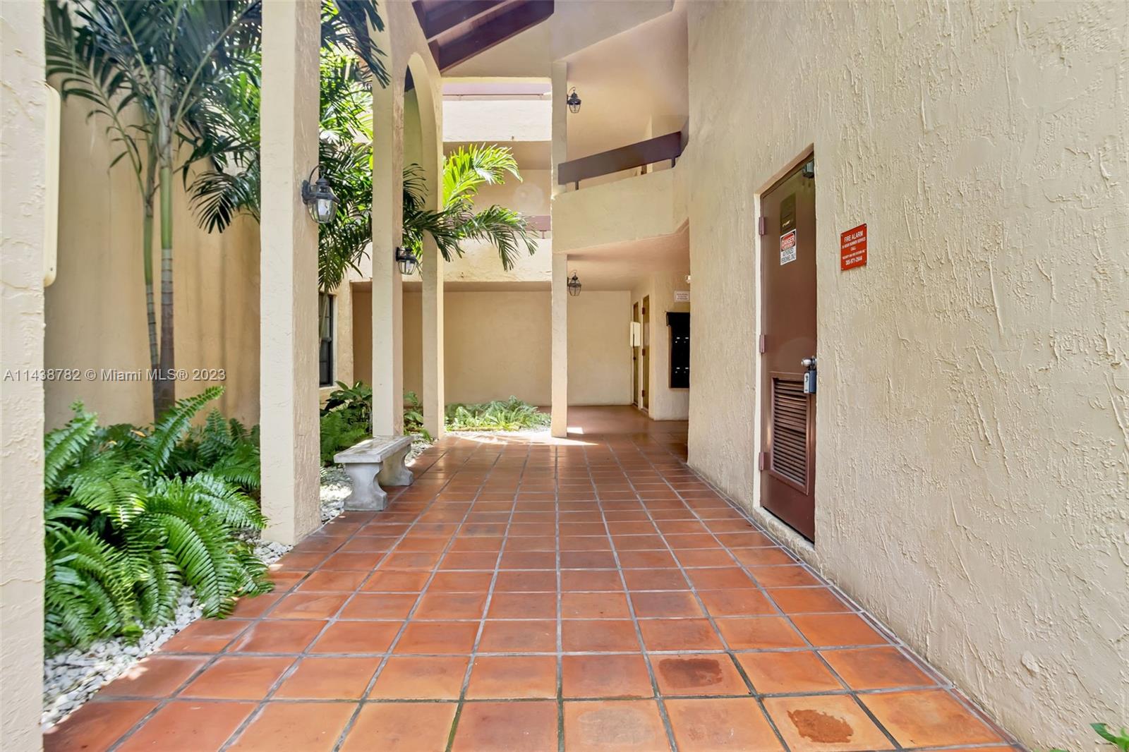 9140 Southwest 123rd Court, Unit 210Q Miami, FL 33186 - Photo 3 of 26 a view of a bunch of flowers in a patio