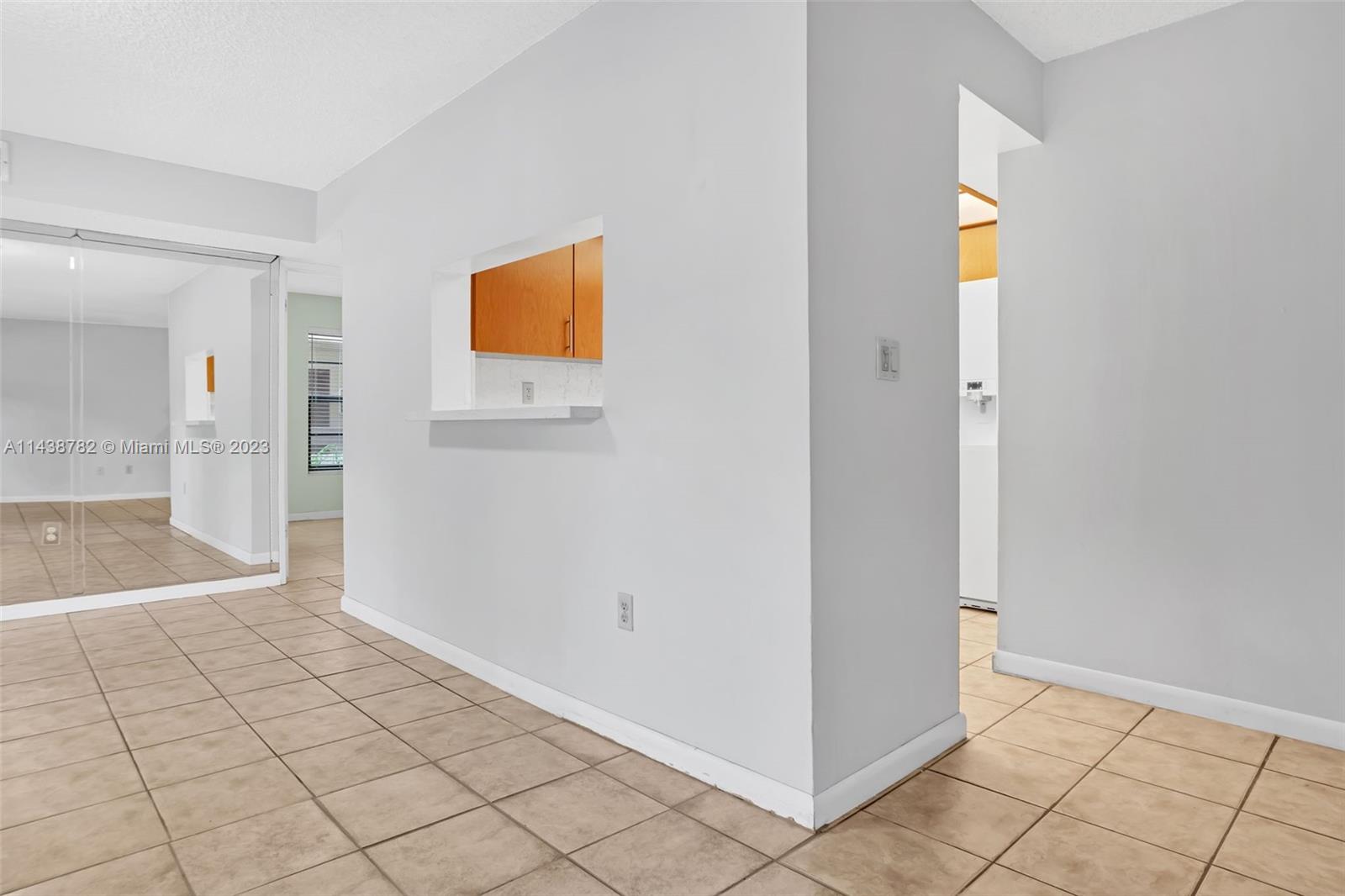 9140 Southwest 123rd Court, Unit 210Q Miami, FL 33186 - Photo 7 of 26 a view of an empty room