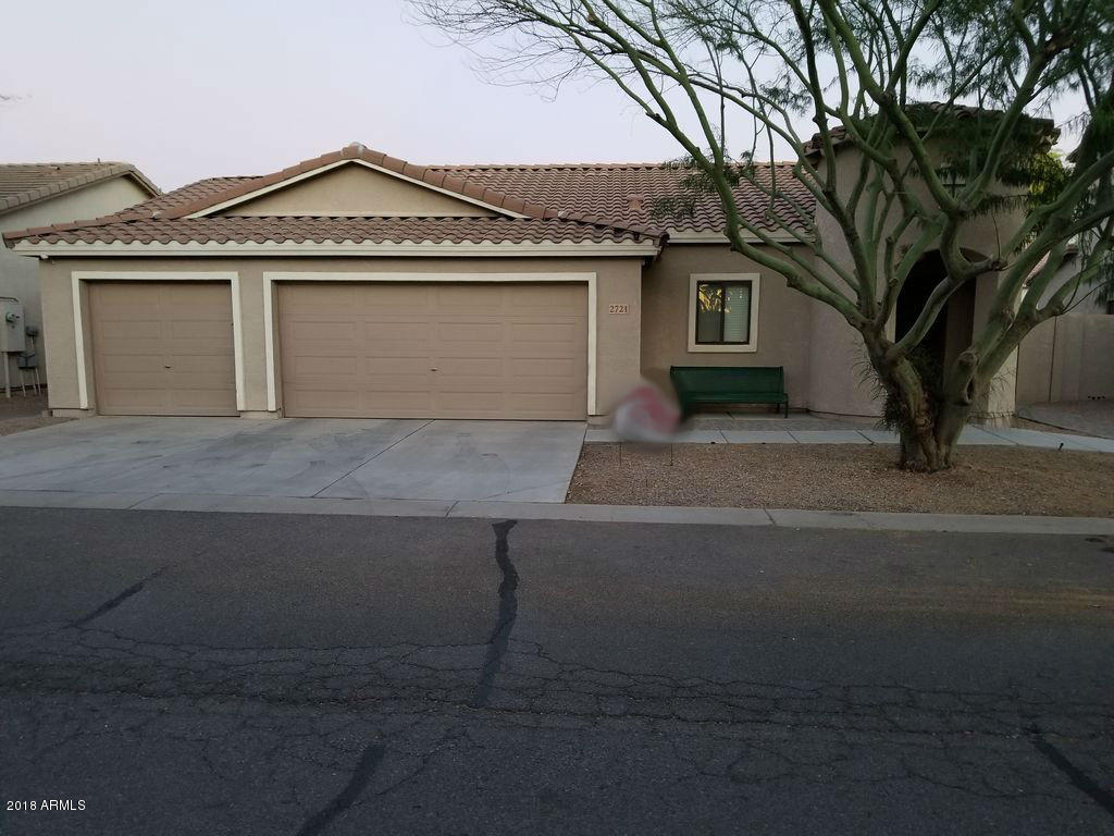 2721 South Powell Road Apache Junction, AZ 85119 - Photo 1 of 25 a front view of a house with a garden and trees