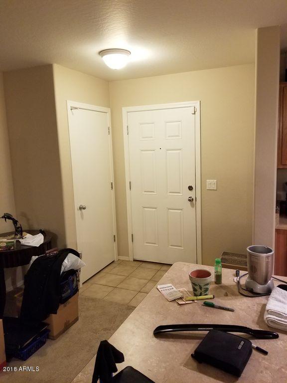 2721 South Powell Road Apache Junction, AZ 85119 - Photo 18 of 25 a bedroom with a bed and a mirror