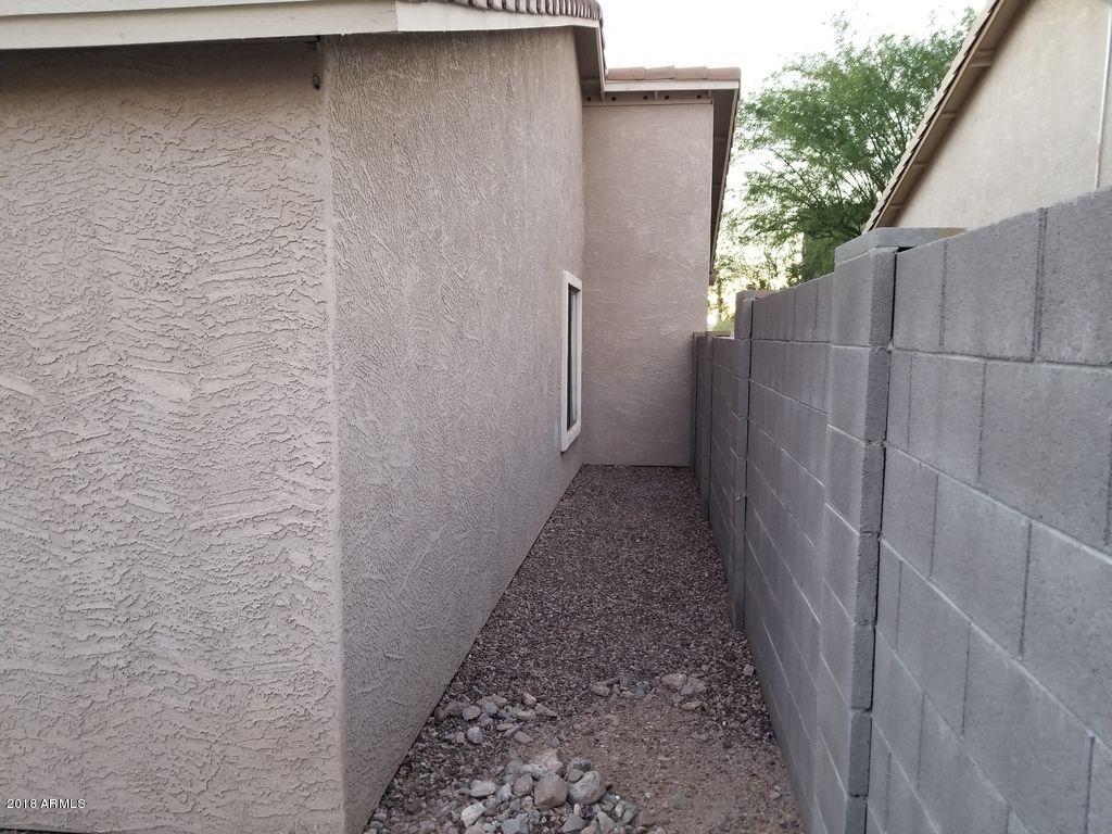 2721 South Powell Road Apache Junction, AZ 85119 - Photo 6 of 25 a view of a pathway of a building with wooden fence