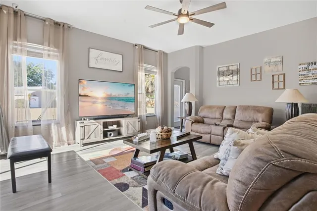 a living room with furniture and a flat screen tv