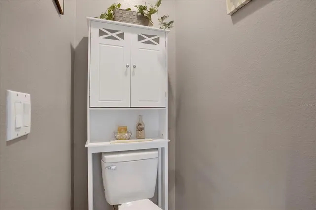 a bathroom with a toilet and a sink