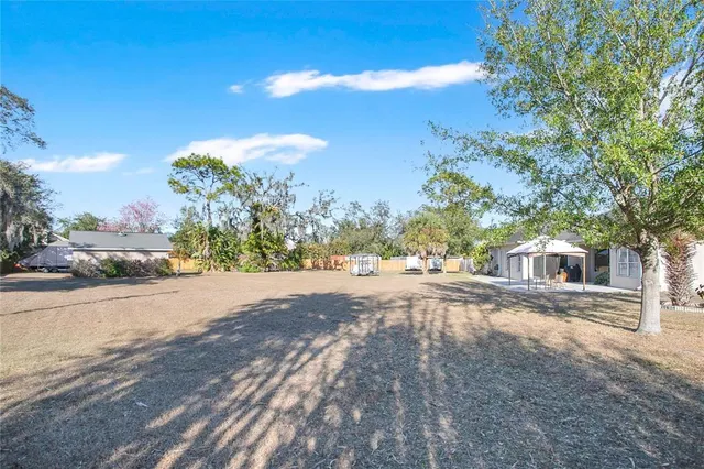 a view of a yard and front view of a house