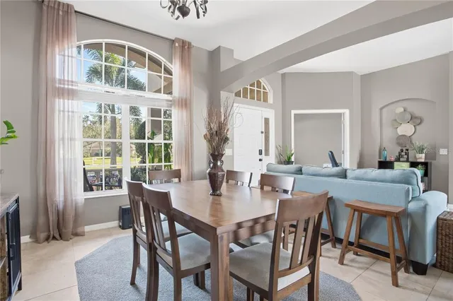 a view of a dining room with furniture and window