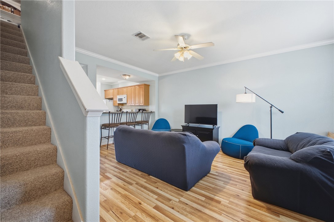 1000 Spring Loop, Unit 2105 College Station, TX 77840 - Photo 6 of 22 a living room with furniture and a flat screen tv