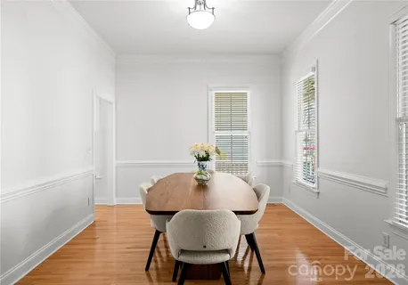a kitchen with granite countertop a sink a stove and cabinets