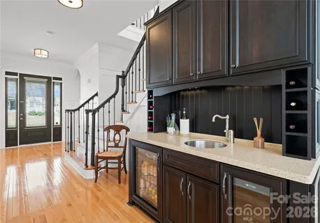 a view of entryway livingroom and hall with wooden floor