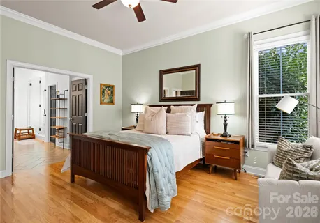 a spacious bathroom with a double vanity sink a large mirror and a shower