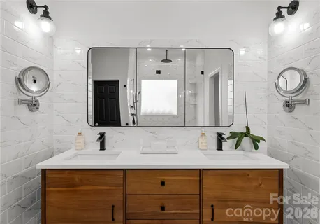 a bathroom with a bathtub and shower