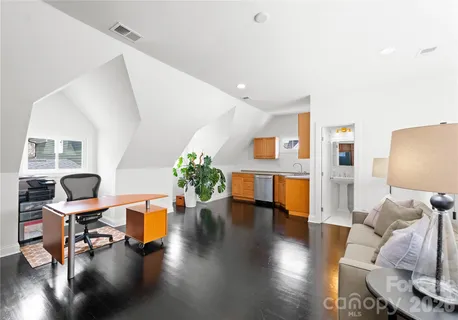 a living room with furniture and a rug