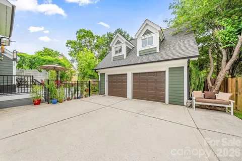 an aerial view of a house with a yard and swimming pool