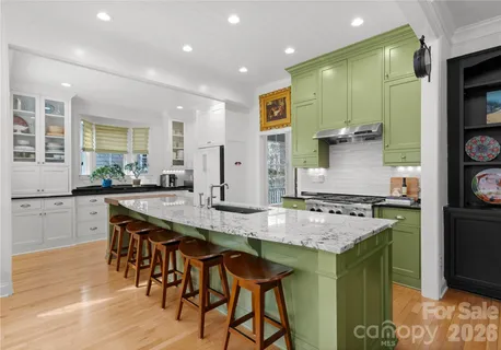 a kitchen with a table and chairs in it