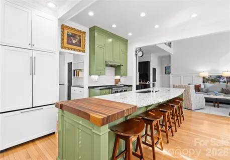 a living room with furniture and a dining table