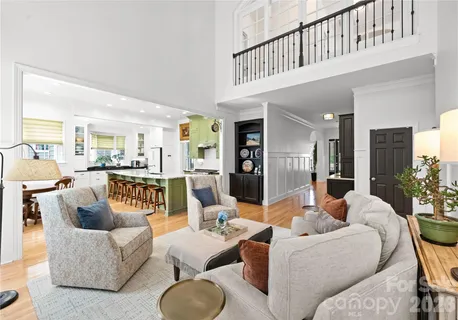 a dining room with furniture and wooden floor
