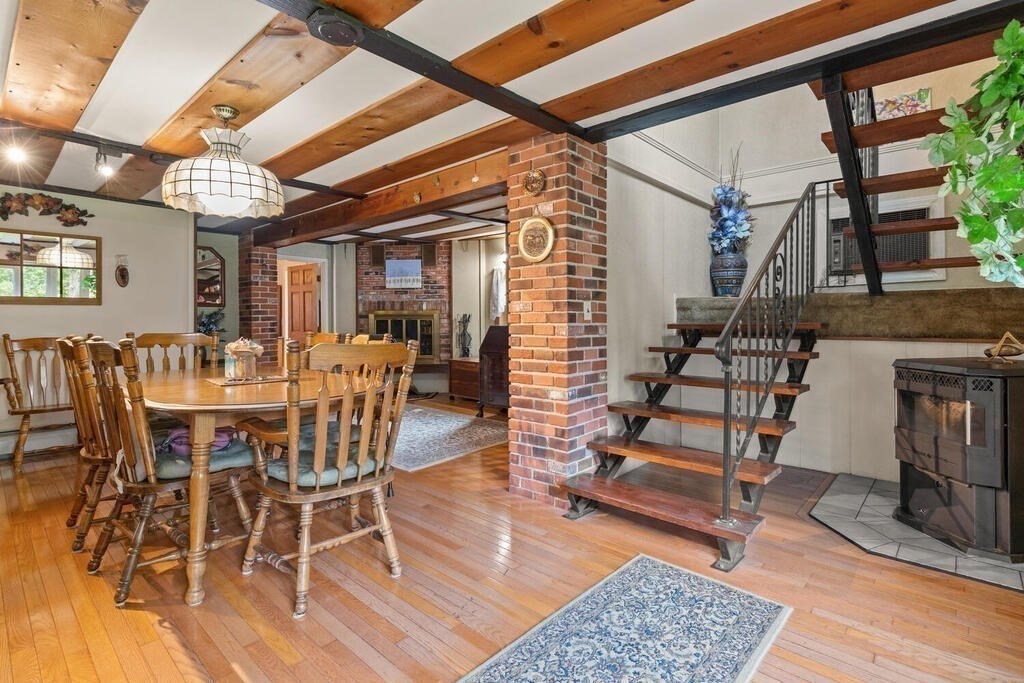 306 Andover Road Billerica, MA 01821 - Photo 11 of 42 a view of a livingroom with furniture and a dining table