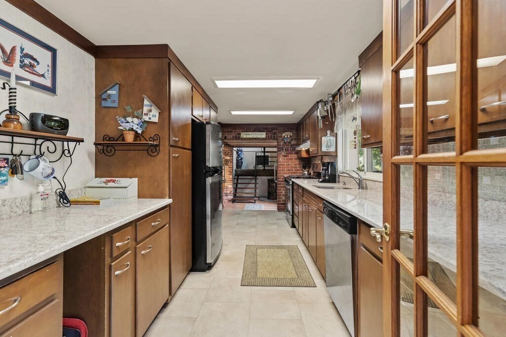 306 Andover Road Billerica, MA 01821 - Photo 12 of 42 a kitchen with counter top space and a sink