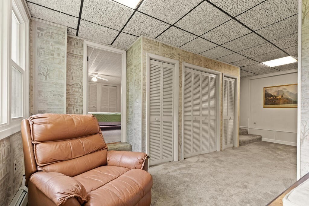 306 Andover Road Billerica, MA 01821 - Photo 18 of 42 a living room with furniture and a rug