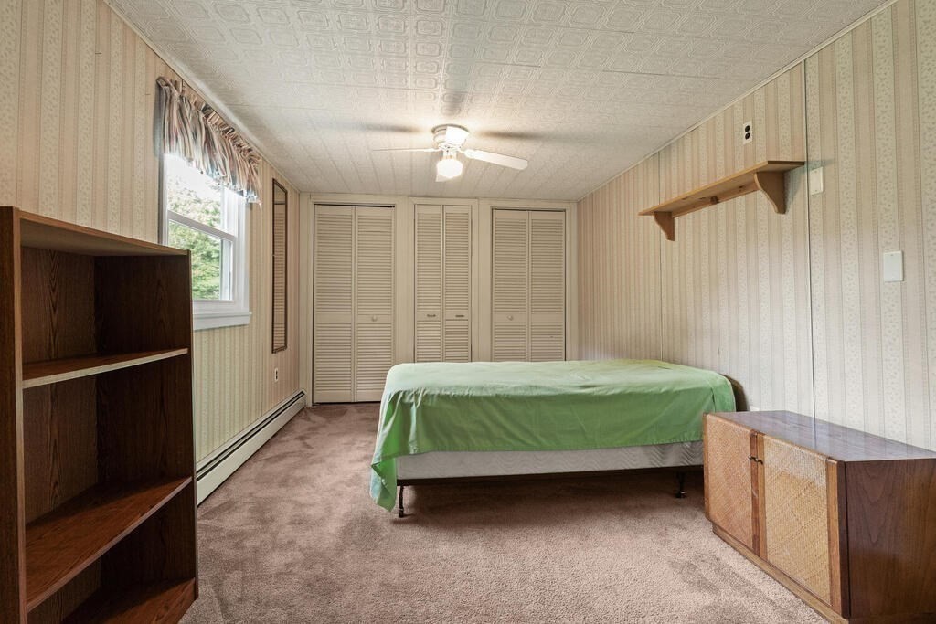 306 Andover Road Billerica, MA 01821 - Photo 22 of 42 a room with a bed and a refrigerator