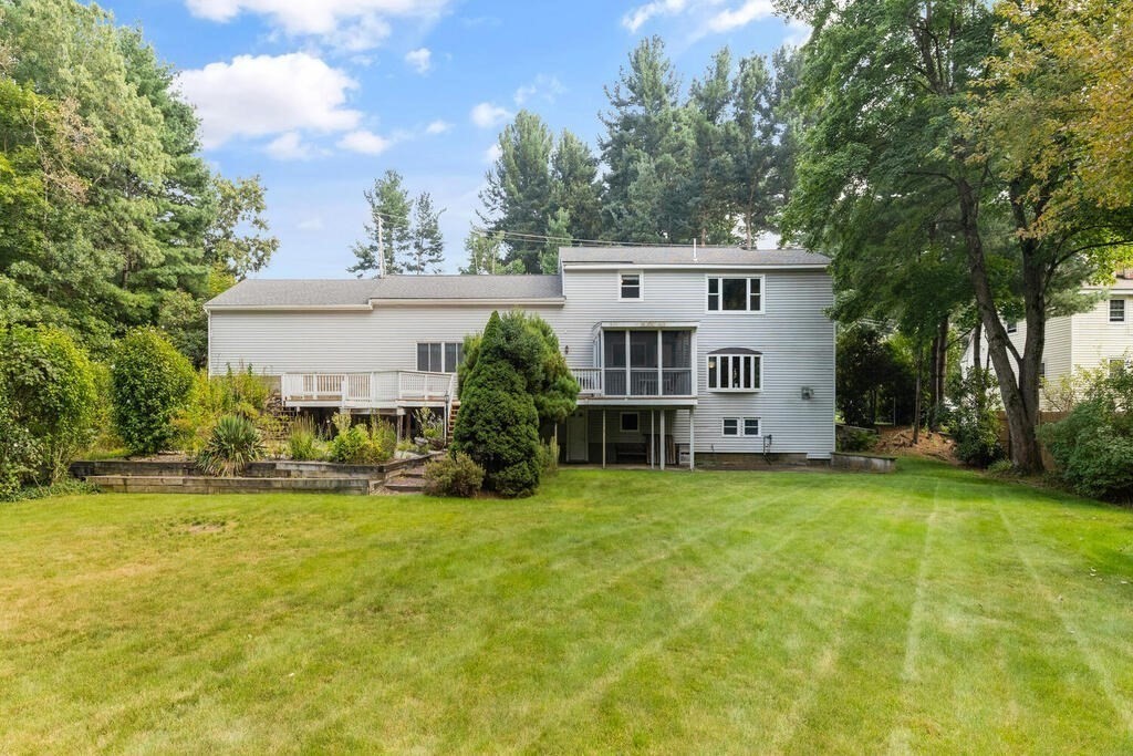 306 Andover Road Billerica, MA 01821 - Photo 36 of 42 a view of a house with a yard