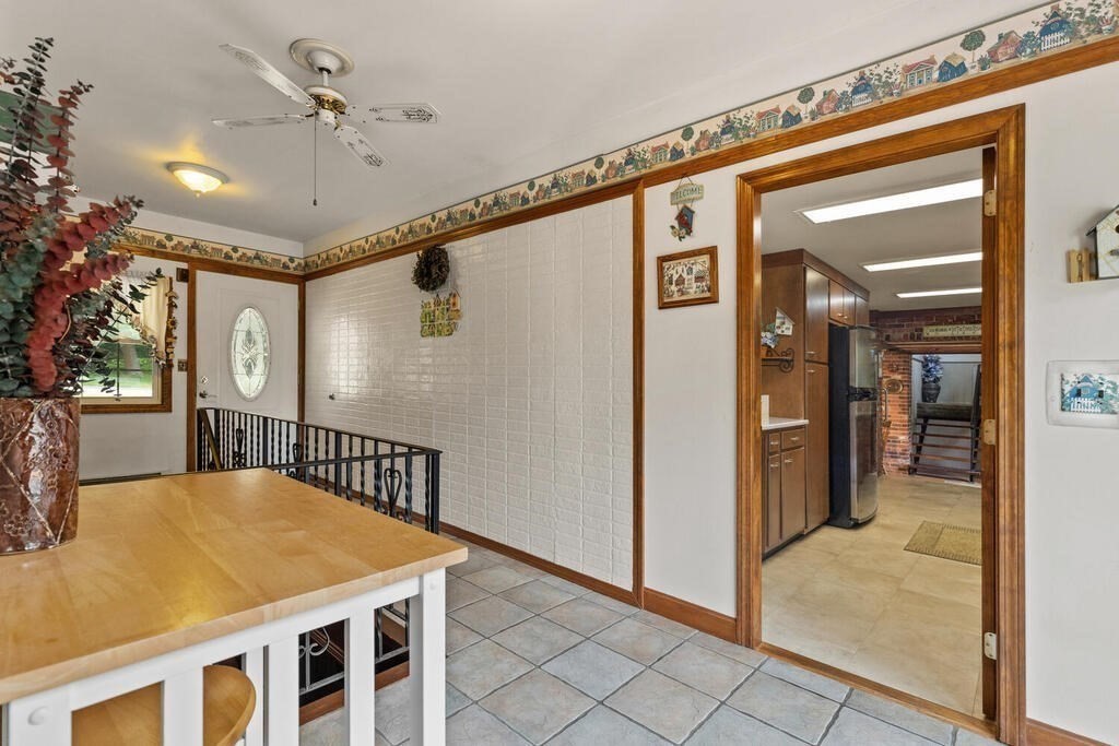 306 Andover Road Billerica, MA 01821 - Photo 4 of 42 a view of a hallway with a dining table