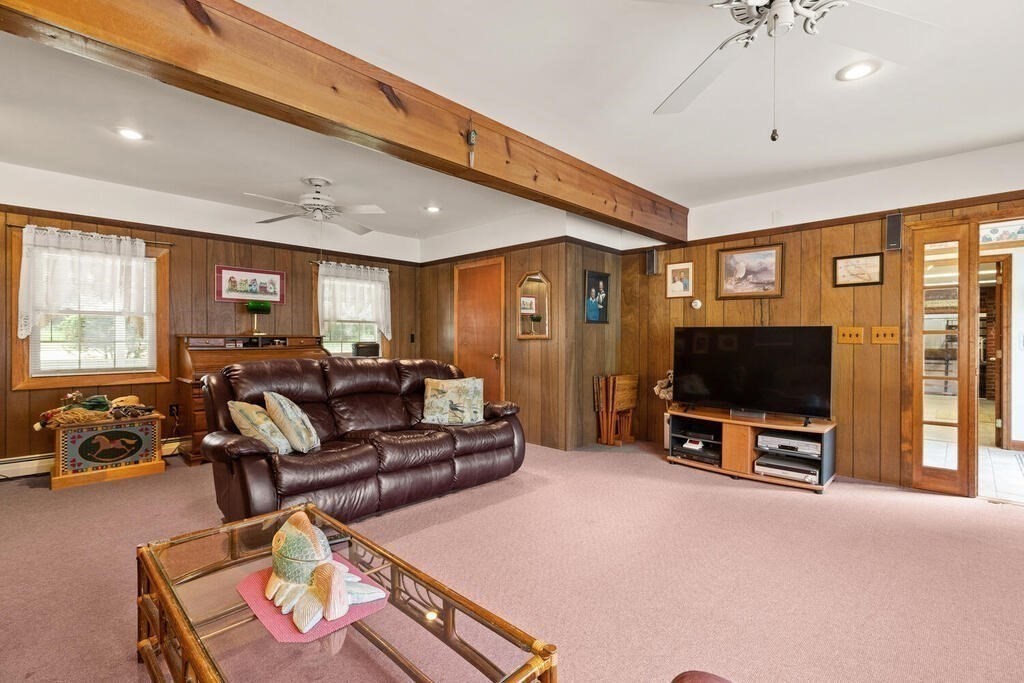 306 Andover Road Billerica, MA 01821 - Photo 6 of 42 a living room with furniture and a flat screen tv