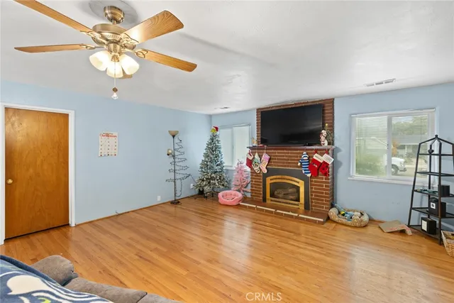 a bedroom with furniture fireplace and a chandelier